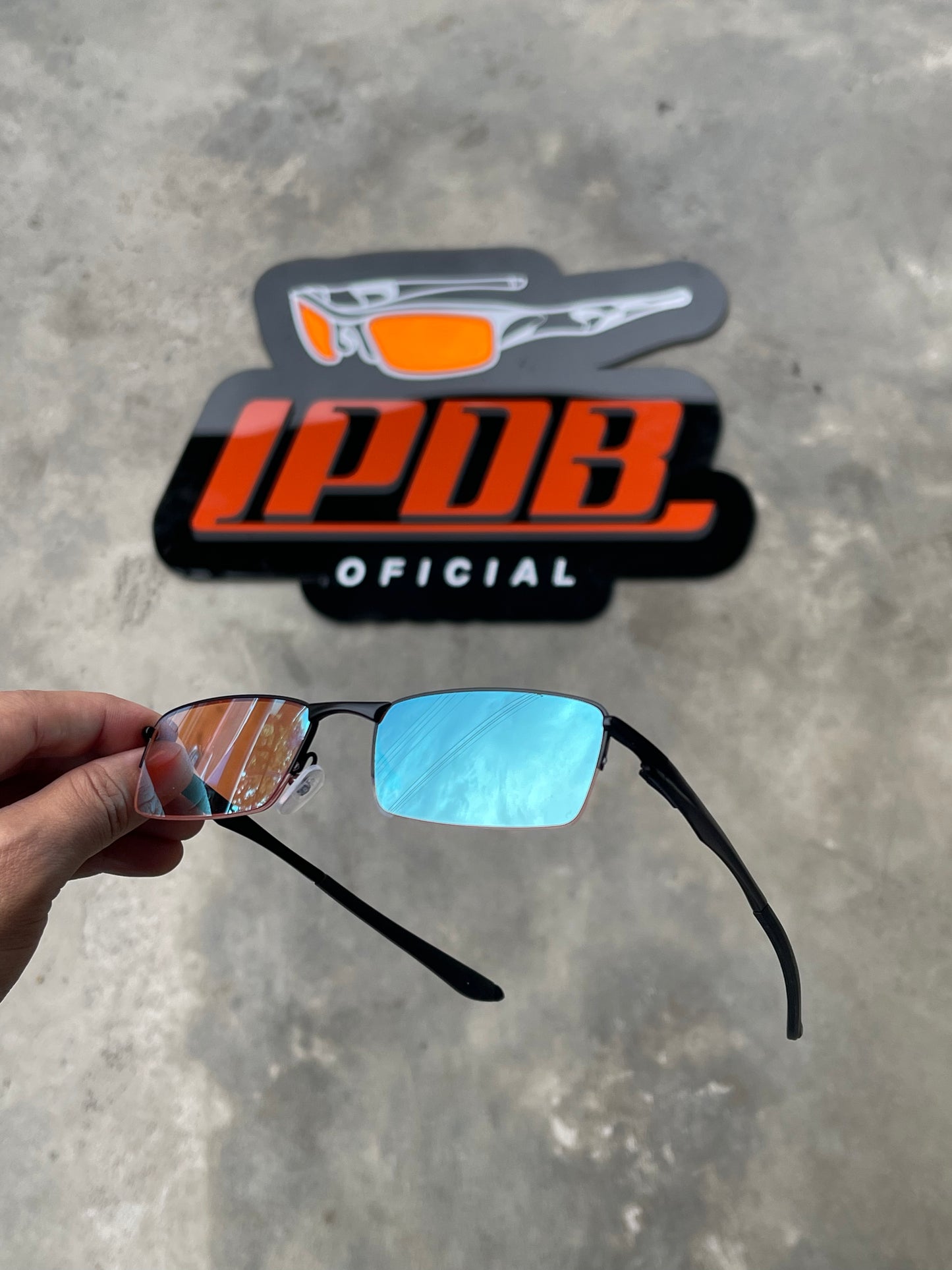 Óculos de Sol Lupa do Vilão Preto Lente Clear Ruby